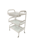Stylish glass and metal salon tools table, white color